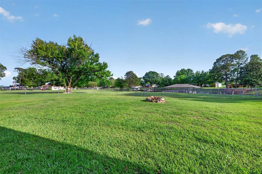 106 Snyder Ranch Road, Trinidad, TX 75163 Massive backyard with covered patio and fire pit
