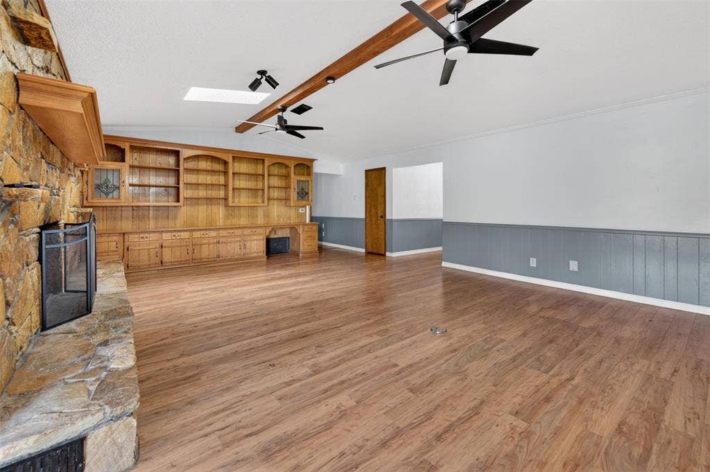 106 Snyder Ranch Road, Trinidad, TX 75163 Living room with massive stone wood-burning fireplace and lots of built-ins