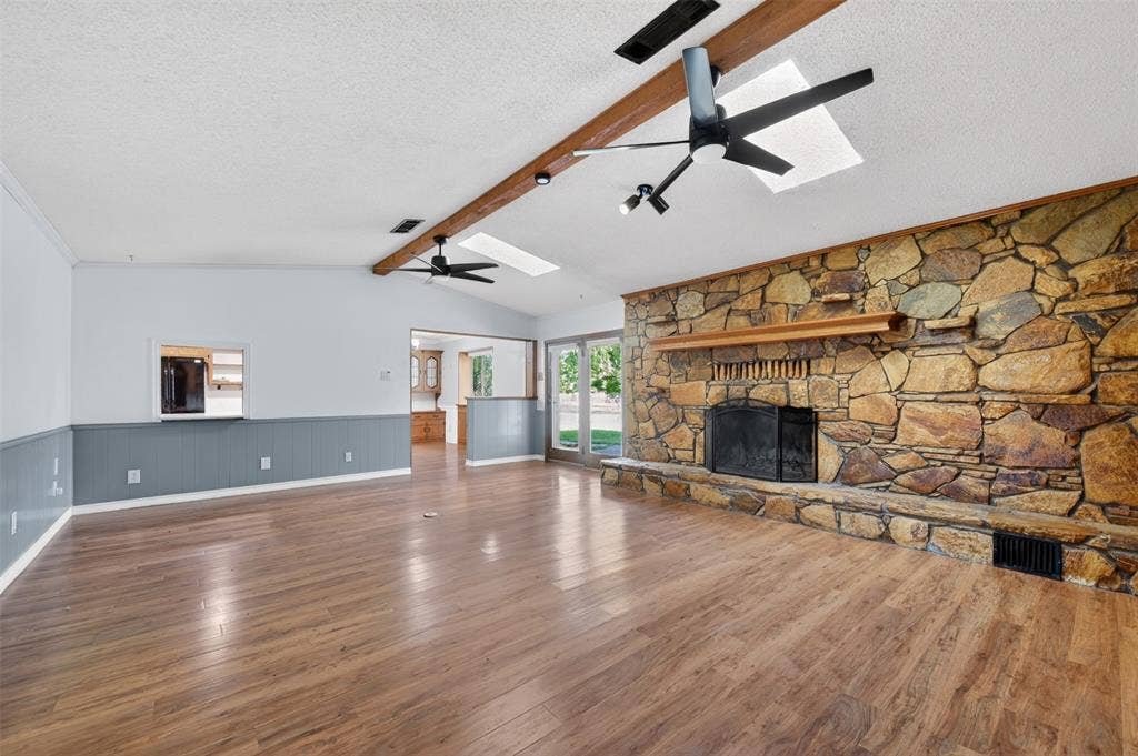 106 Snyder Ranch Road, Trinidad, TX 75163 Living room with massive stone wood-burning fireplace and lots of built-ins