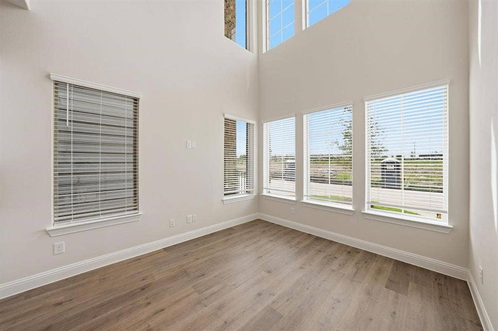 4532 Community Court, Plano, TX 75024 Two-story ceilings, a wall of windows, and wood-finish flooring