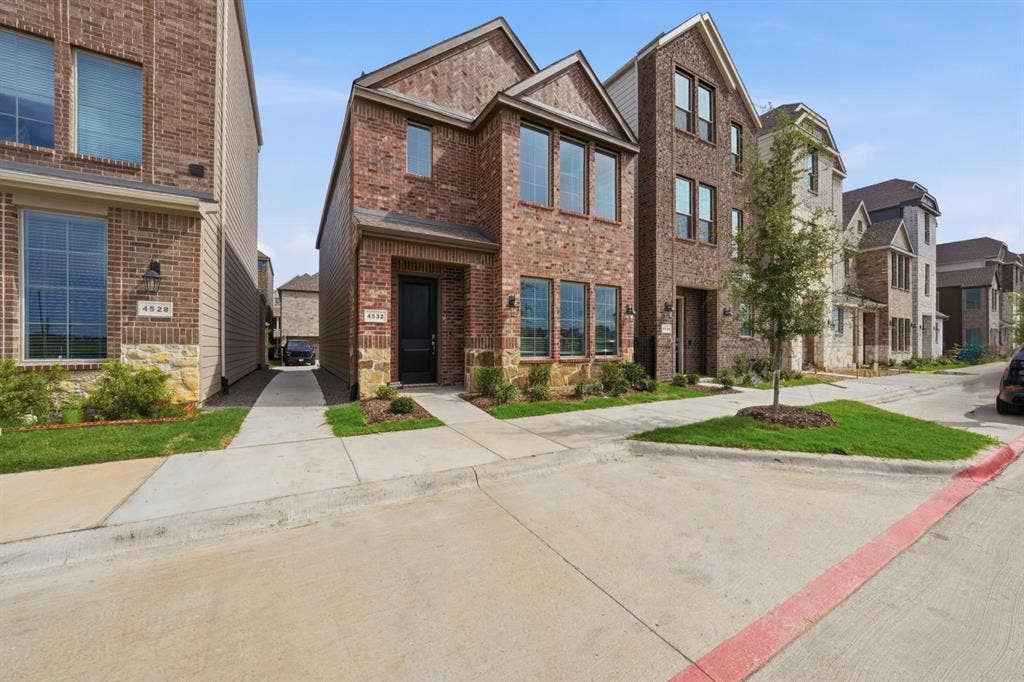 4532 Community Court, Plano, TX 75024 Brick exterior with stone accents, mature landscaping, and a paved driveway