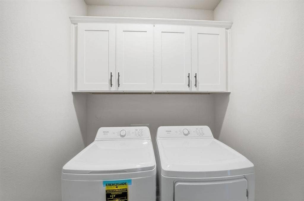 4532 Community Court, Plano, TX 75024 White shaker-style cabinetry with dark hardware