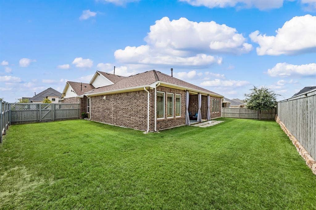 2900 Peekaboo Lane, Northlake, TX 76247 Expansive fenced backyard with a covered patio, and extended fence so you can enjoy more of the backyard and more privacy!