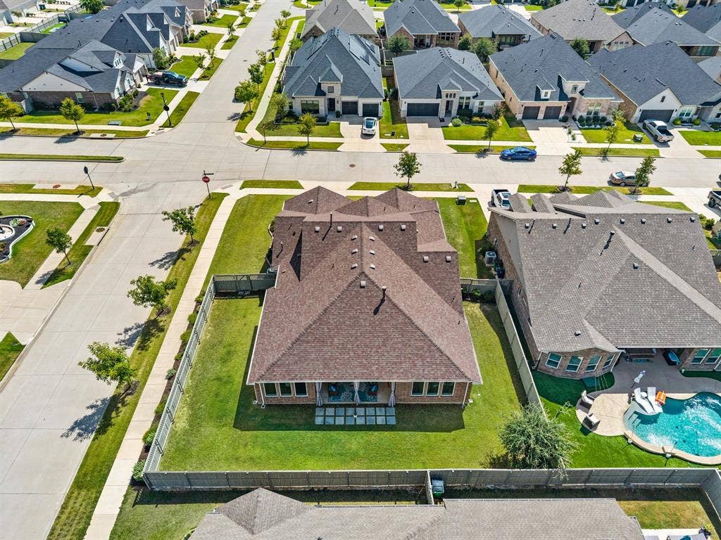 2900 Peekaboo Lane, Northlake, TX 76247 Expansive fenced backyard with a manicured lawn...What a beautiful place to call home!