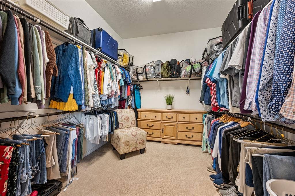2900 Peekaboo Lane, Northlake, TX 76247 The over sized primary closet will give you so much room for all your clothes plus some. As you can see there is a large dresser in here. The sellers had the primary closet built a tad bit bigger when the built their home.
