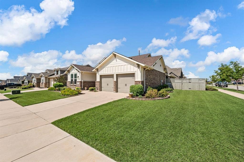2900 Peekaboo Lane, Northlake, TX 76247 Amazing home featuring a three-car tandum garage, corner and landscaped front yard and a great place to come home to!