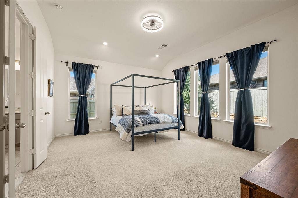 2900 Peekaboo Lane, Northlake, TX 76247 Large and private primary bedroom that has so much space for all your large bedroom furniture...