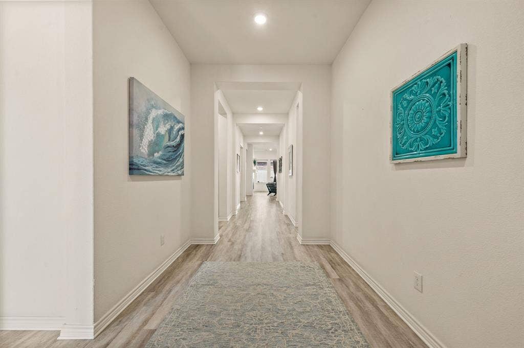2900 Peekaboo Lane, Northlake, TX 76247 large open and wonderfully lighted foyer featuring LVP flooring, recessed lighting, and crisp white walls! You will Love welcoming your friends and family to your new home!