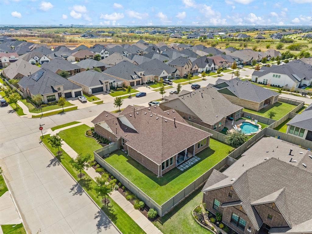 2900 Peekaboo Lane, Northlake, TX 76247 Private backyard with a covered patio, complete backyard private fencing that was extended for extra yard and privacy.