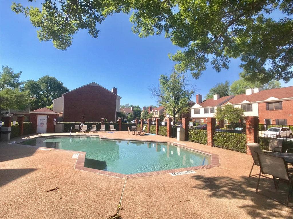 216 Samuel Boulevard, #j3, Coppell, TX 75019 Swimming pool with a textured deck, surrounded by mature trees and brick fencing