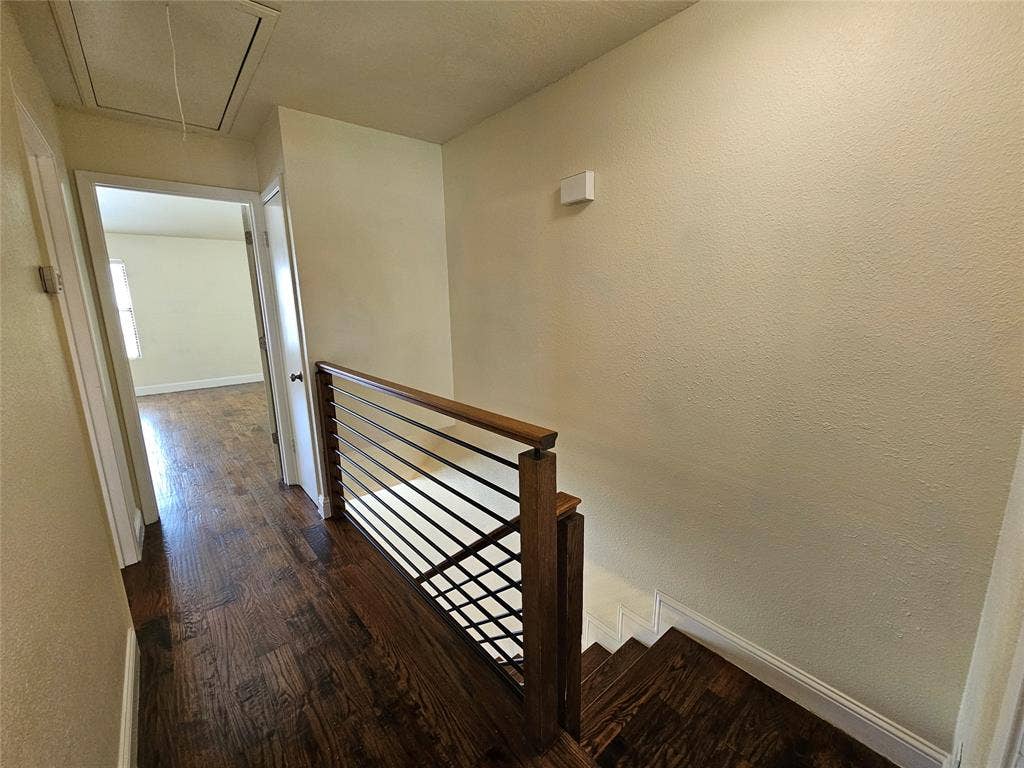 216 Samuel Boulevard, #j3, Coppell, TX 75019 Hardwood flooring throughout, modern horizontal metal railing, and staircase with wood treads