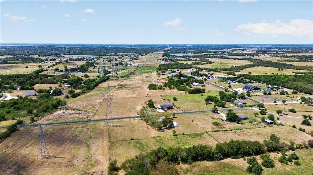 11929 County Road 950, Rockwall, TX 75087 Expansive rural landscape featuring scattered residences, cultivated fields, and distant tree lines