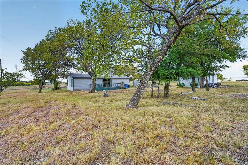 11929 County Road 950, Rockwall, TX 75087 Expansive lot with mature trees and a rear deck