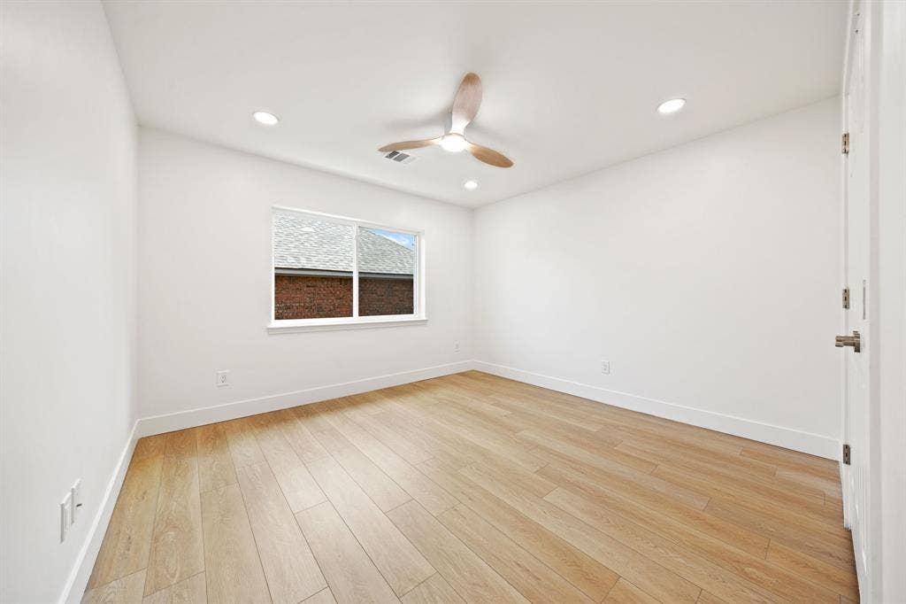 7504 Hughes Drive, Plano, TX 75024 Bright interior space featuring light wood-finish flooring, white walls, and a recessed lighting package