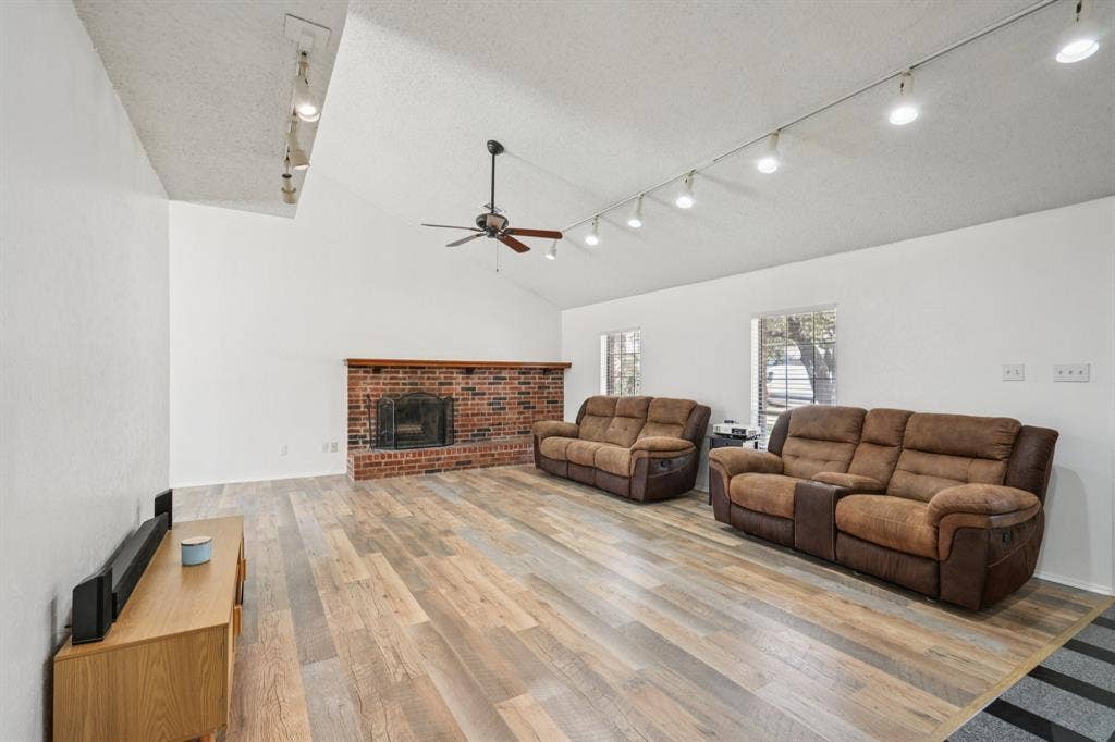 2307 Harrington Court, Euless, TX 76039 Open Living Room with Fireplace