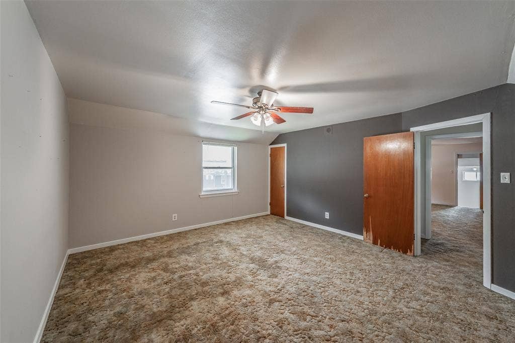1313 Killian Drive, Arlington, TX 76013 Carpeted flooring, ceiling fan with light fixture, window with white trim, wood-finish doors, and painted walls