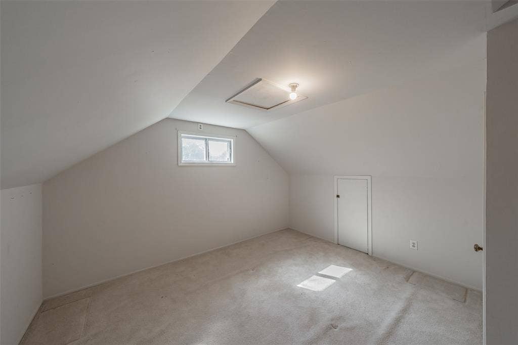 1313 Killian Drive, Arlington, TX 76013 Carpeted room with sloped ceilings, a single window, and an access panel