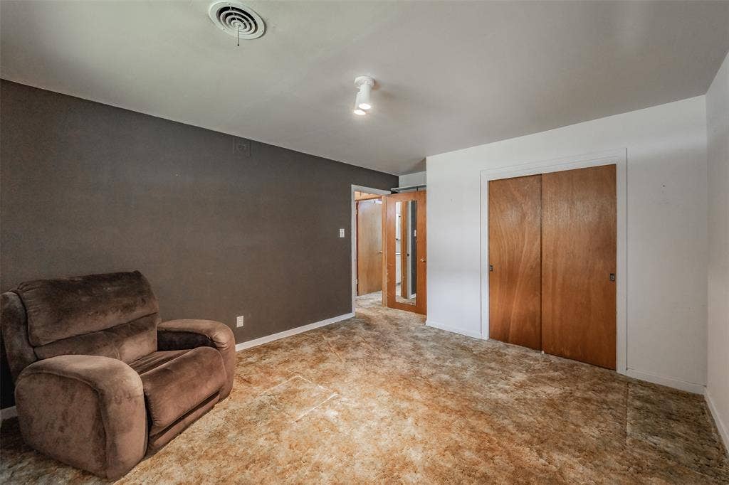1313 Killian Drive, Arlington, TX 76013 Neutral wall tones with a wood-finish closet door