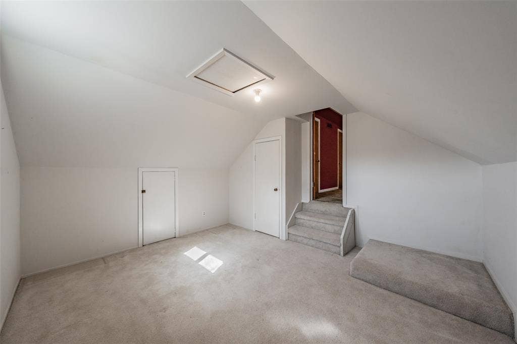 1313 Killian Drive, Arlington, TX 76013 Carpeted flooring, sloped ceiling, recessed storage doors, and a built-in step-up platform