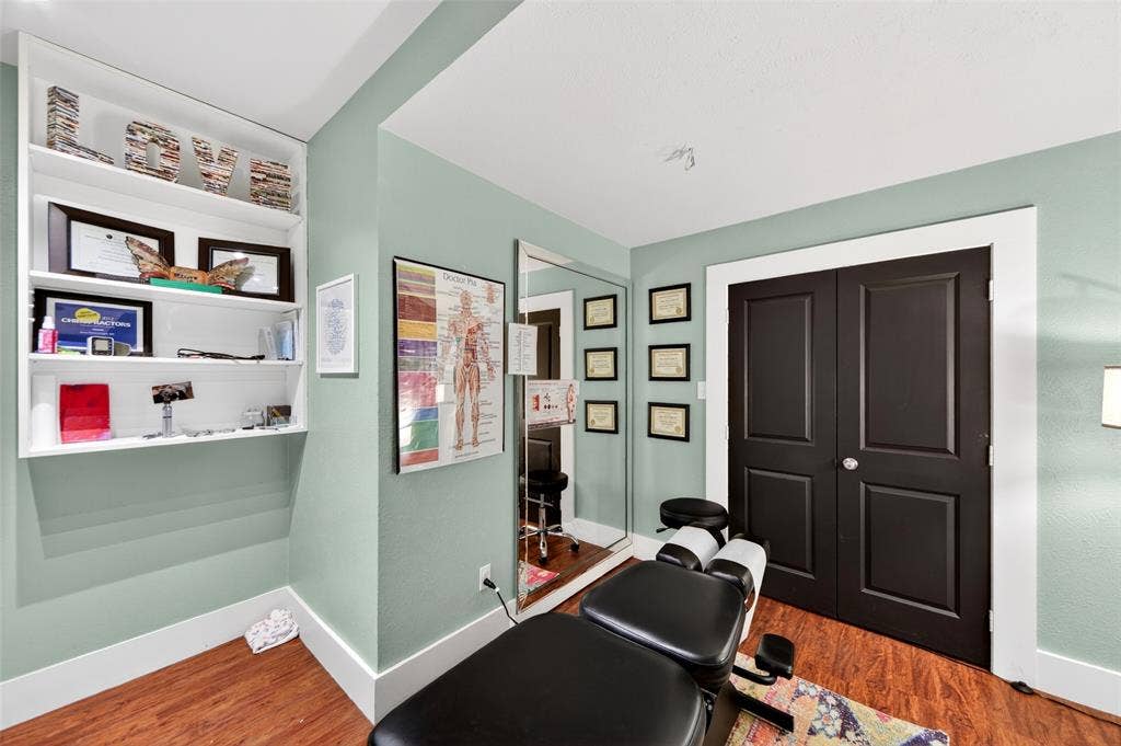 508 W Main Street, Allen, TX 75013 Built-in shelving, wood-finish flooring, full-length mirror, and paneled double doors