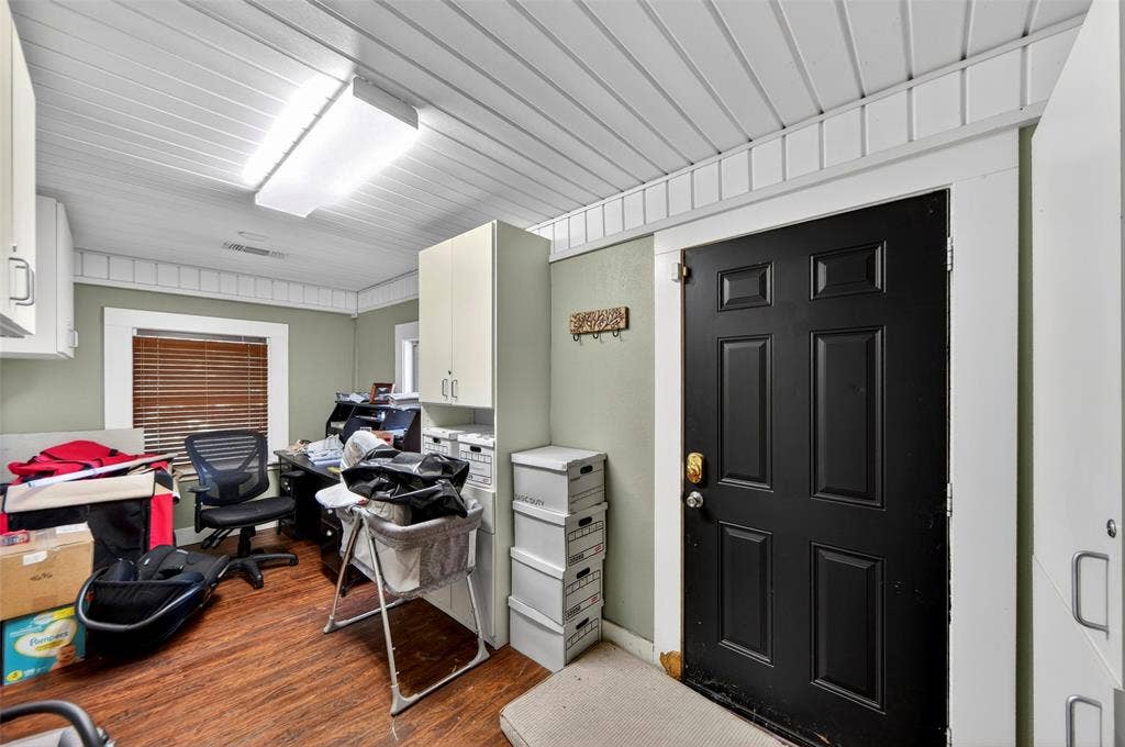 508 W Main Street, Allen, TX 75013 White plank ceiling with decorative trim, wood-finish flooring, and white built-in cabinetry