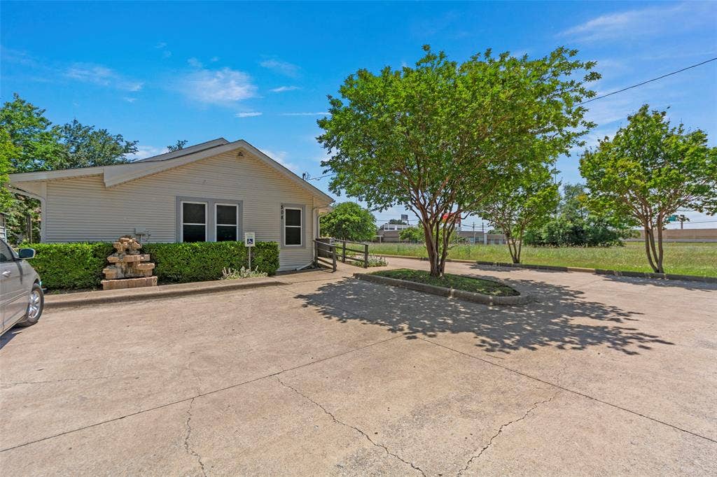 508 W Main Street, Allen, TX 75013 Single-story exterior with light-colored siding, a pitched roof, and multiple windows