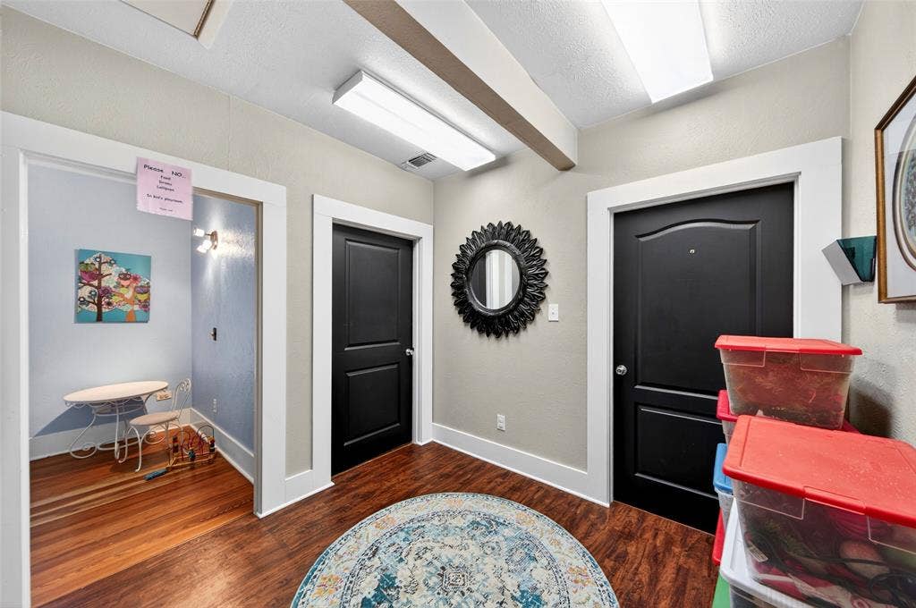 508 W Main Street, Allen, TX 75013 Hallway featuring wood-finish flooring, white trim, and recessed lighting