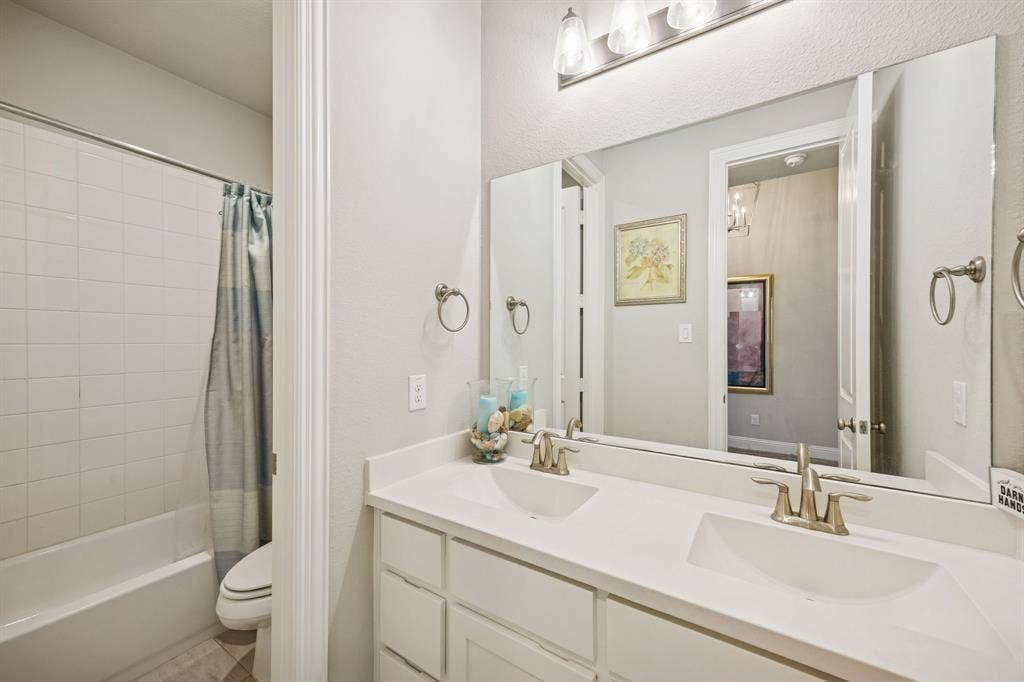guest bathroom with shower tub combo