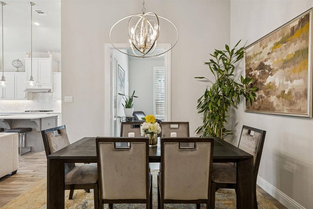 formal dining with beautiful modern lighting
