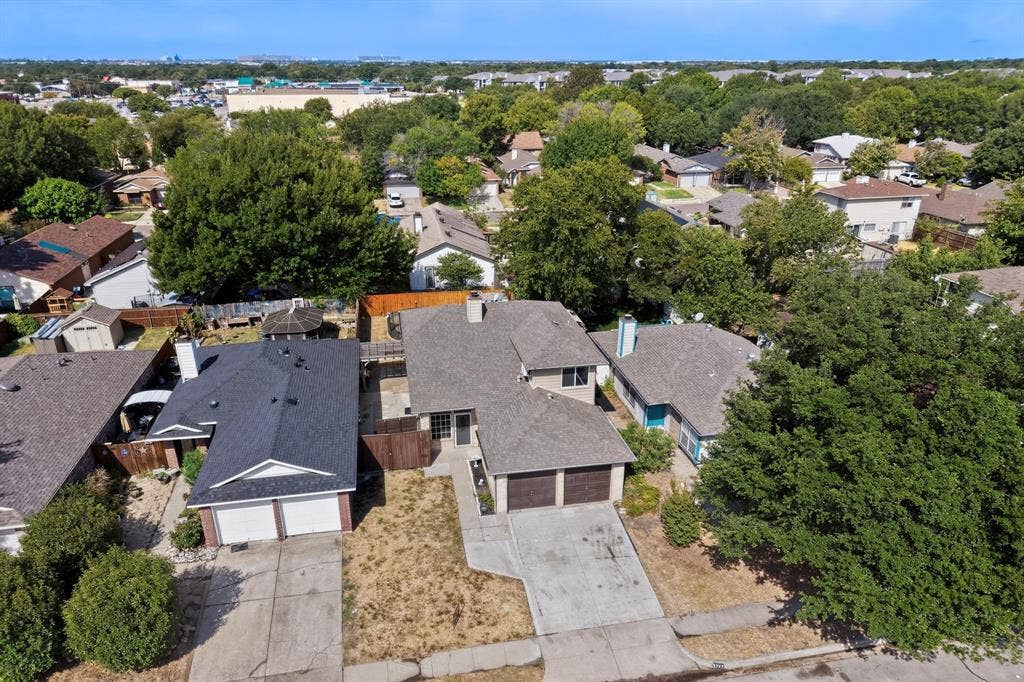 6747 Silver Sage Drive, Fort Worth, TX 76137 Aerial perspective showcasing two properties with attached garages