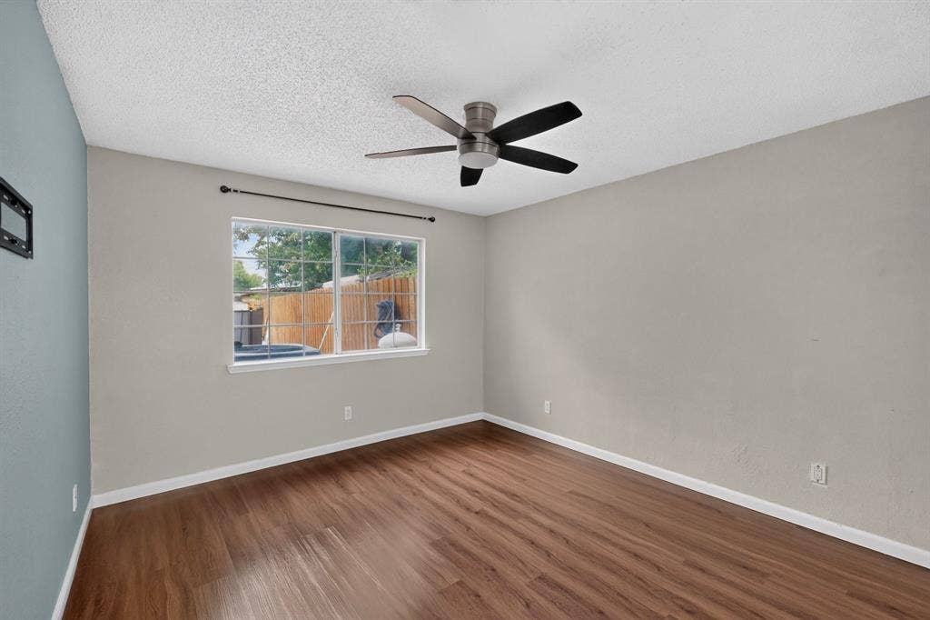 6747 Silver Sage Drive, Fort Worth, TX 76137 Wood-finish flooring with white trim