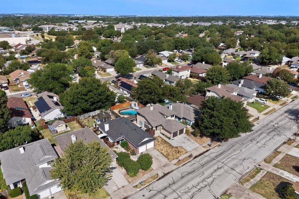 6747 Silver Sage Drive, Fort Worth, TX 76137 Residential neighborhood with mature trees and a clear sky