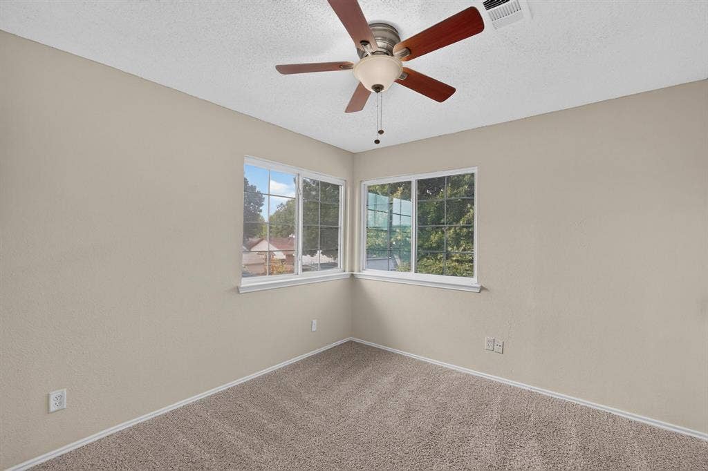 6747 Silver Sage Drive, Fort Worth, TX 76137 Recessed lighting with a ceiling fan, dual pane windows, and neutral carpeting
