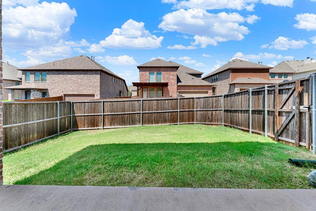12038 Big Springs Drive, Frisco, TX 75035 A fully enclosed, privacy-fenced lawn offers a secure green space with clear views of the open Texas sky. It is the ultimate spot for pets to run free or to set up a private outdoor play area