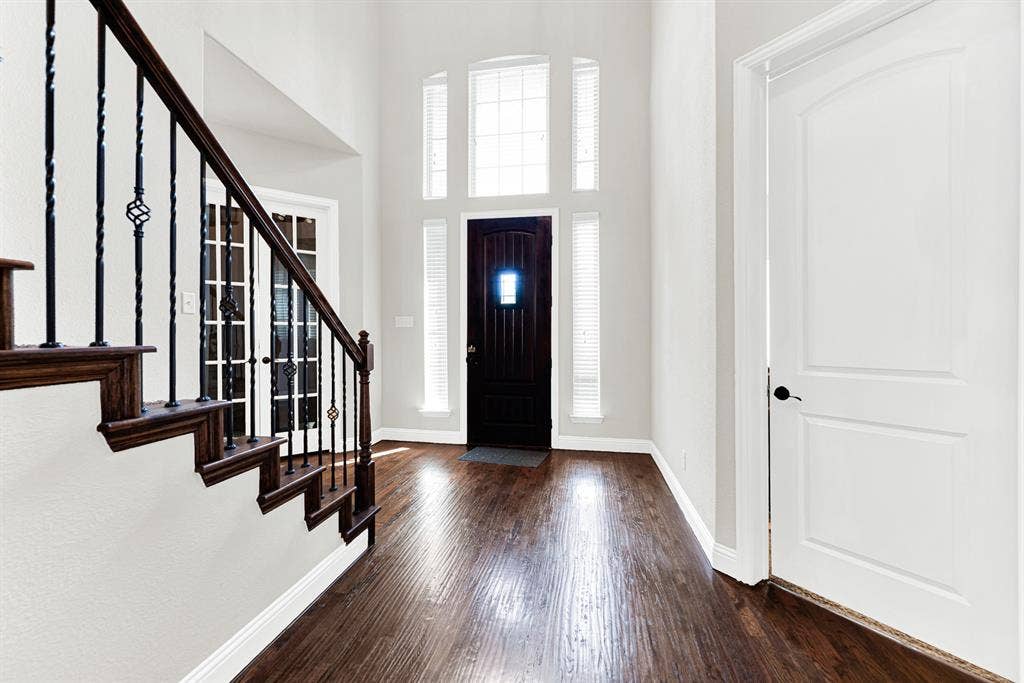 12038 Big Springs Drive, Frisco, TX 75035 A grand entryway featuring tall transom windows over the front door creates a bright, soaring welcome. Imagine stepping through the door after a long day and instantly feeling right at home.