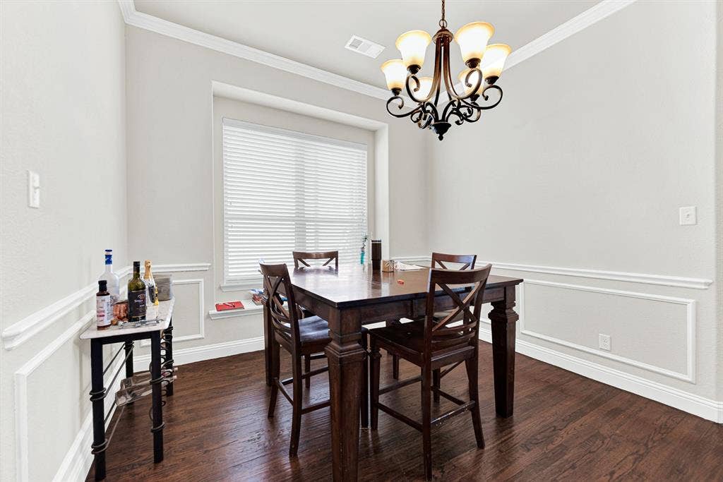 12038 Big Springs Drive, Frisco, TX 75035 Elegant wainscoting adds a classic, tailored look that visually frames this dedicated entertaining space.This is the perfect setting for hosting intimate, candlelit dinner parties with your closest friends.
