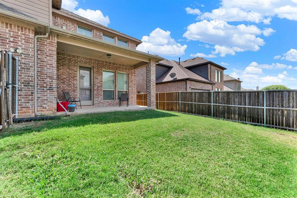 12038 Big Springs Drive, Frisco, TX 75035 A deep covered patio provides a cool, shaded sanctuary right off the main house. Settle in with a cold drink and enjoy outdoor relaxation no matter the summer heat.
