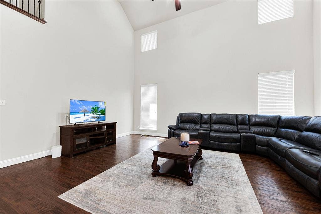12038 Big Springs Drive, Frisco, TX 75035 Stacked two-story windows flood the rich wood floors with soft, glowing sunlight throughout the day. Start your morning right here, sipping hot coffee while watching the early light pour in.