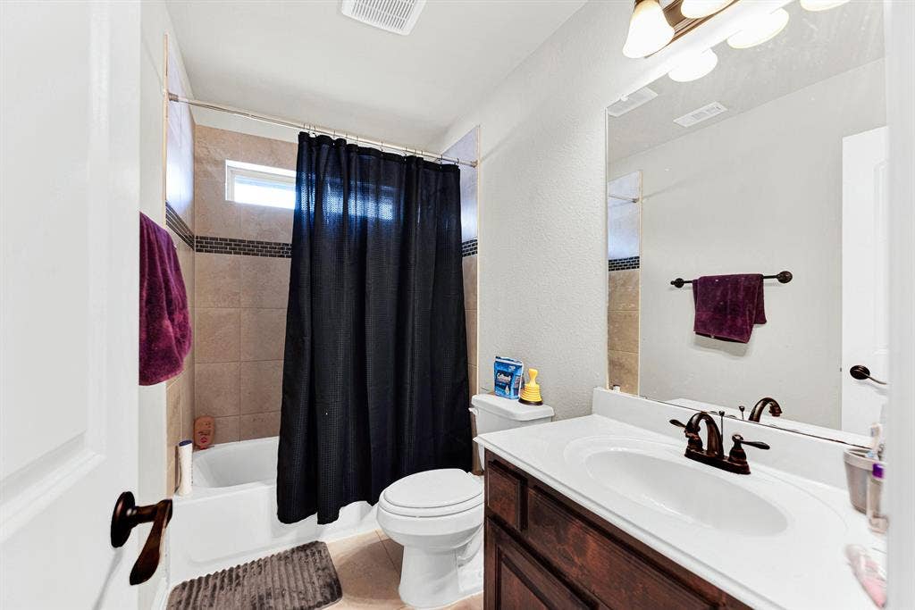 12038 Big Springs Drive, Frisco, TX 75035 A high horizontal window over the shower enclosure draws in gentle top lighting while keeping the layout private. It is just what you need for a quick prep before heading out the door for weekend errands.