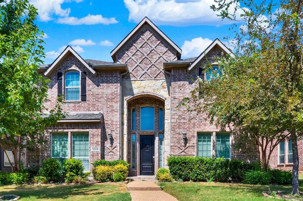 12038 Big Springs Drive, Frisco, TX 75035 Welcome to 12038 Big Springs in Frisco! Striking brick masonry with geometric detailed accents and a soaring grand entryway give this facade an undeniable curb appeal. Stepping through the front door feels like an immediate retreat into luxury every afternoon.