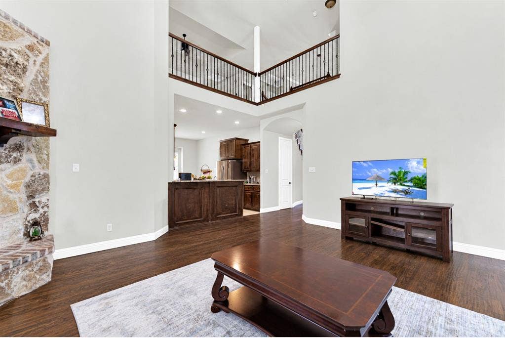 12038 Big Springs Drive, Frisco, TX 75035 Clean architectural lines and wide arched doorways create an airy flow into the adjoining rooms. You can easily imagine keeping an eye on the family while prepping dinner just steps away.