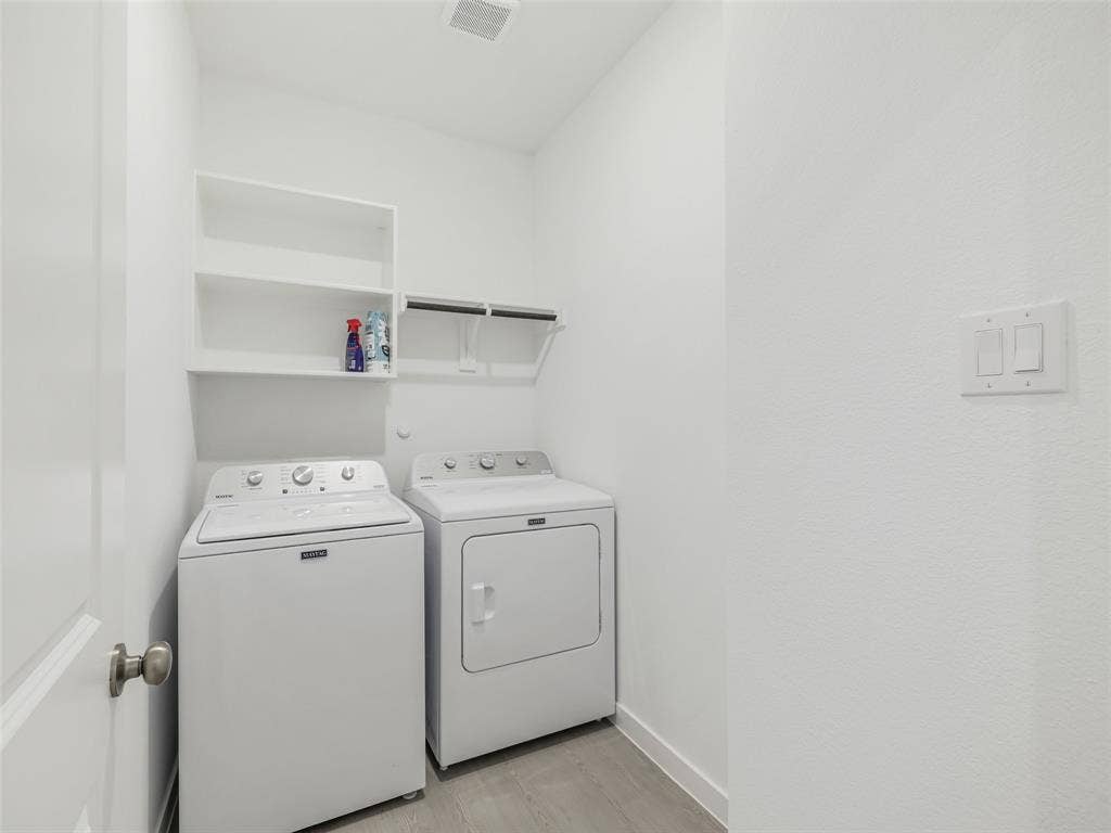 2517 Greenbelt Road, Celina, TX 75009 Dedicated laundry space with built-in shelving and wood-finish flooring
