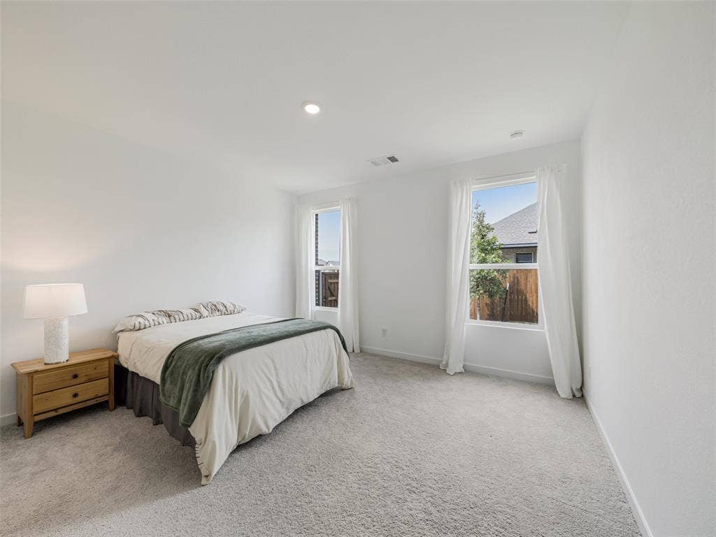 2517 Greenbelt Road, Celina, TX 75009 Recessed ceiling lighting, white painted walls, two windows, wall-to-wall carpeting