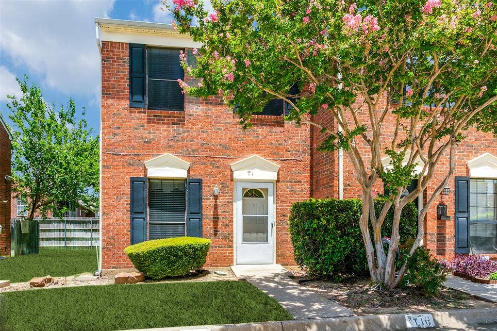 238 Samuel Boulevard, #1T, Coppell, TX 75019 Brick exterior with white trim