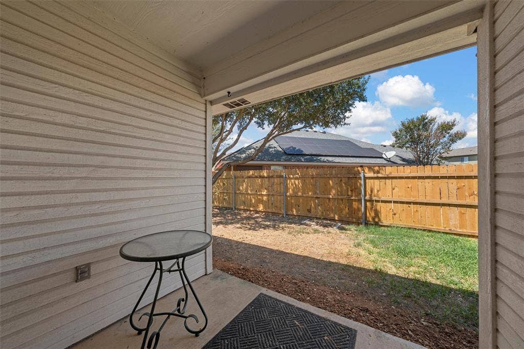 Covered concrete patio with siding exterior