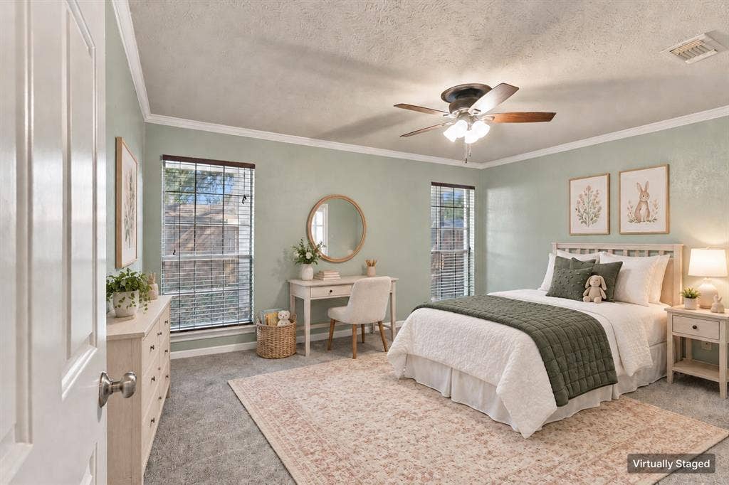 1309 Oxford Lane, Denton, TX 76209 Textured wall finish, ceiling fan, crown molding, two windows with blinds, and carpeting