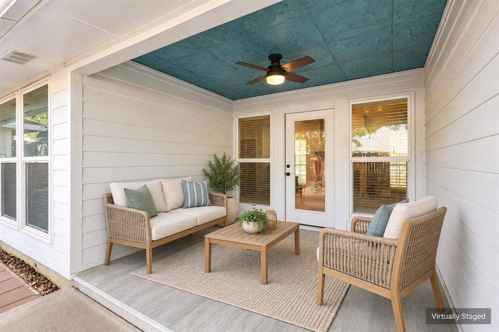 1309 Oxford Lane, Denton, TX 76209 Covered outdoor patio with a textured teal ceiling, ceiling fan, and wood-finish flooring