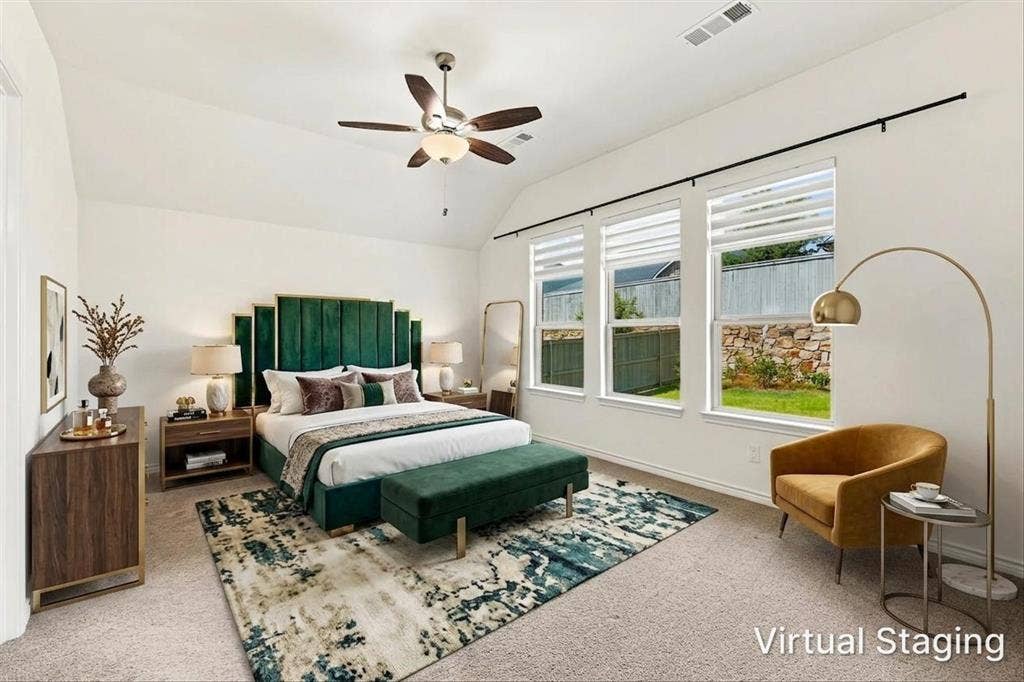 2812 Dunbar Drive, Northlake, TX 76247 Vaulted ceiling with a ceiling fan, three large windows with roller shades, and plush carpeting