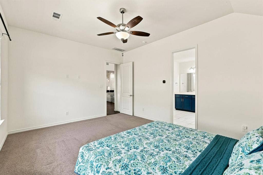 2812 Dunbar Drive, Northlake, TX 76247 Vaulted ceiling with a ceiling fan, neutral carpet, and white walls