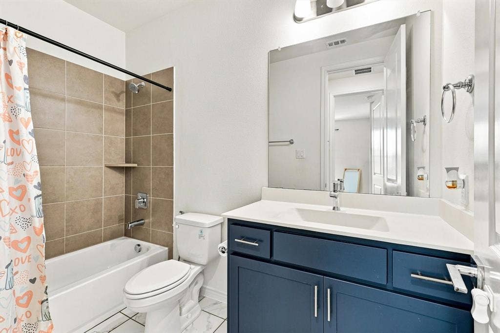 2812 Dunbar Drive, Northlake, TX 76247 White tub with chrome fixtures and tan tile surround